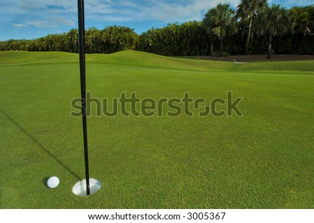 putt of three inches on manicured golf green