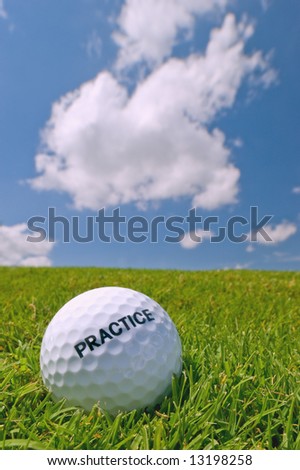 practice golf ball on grass bunker with blue sky background