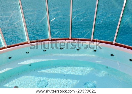 spa pool on luxury cruise ship overlooking ocean
