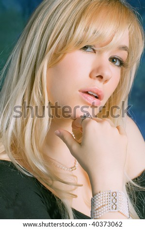 lovely blond female model with pearl bracelet