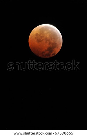 MIAMI - DEC. 21: A rare total lunar eclipse coinciding with the first day of winter is seen in the night sky on Dec. 21, 2010 near Miami, Florida.