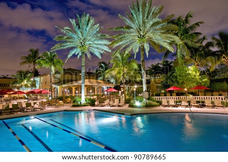 elegant tropical pool and patio at night