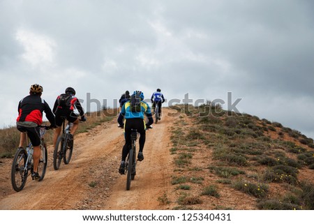 ALMATY, KAZAKHSTAN - APRIL 30: Unidentified bikers in action at Adventure mountain bike cross-country marathon in mountains \