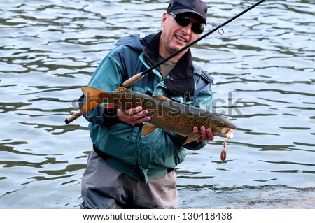 Fishing on river Shishged in the Mongolia - the lenok fish in hand