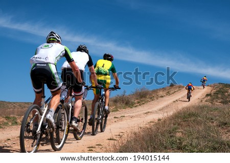 ALMATY, KAZAKSTAN - MAY 01, 2014: Unidentified bikers in action at Adventure mountain bike cross-country marathon in mountains \