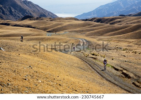 ALMATY, KAZAKHSTAN - SEPTEMBER 09, 2014: Unknown bikers  in action at Adventure mountain bike cross-country marathon \