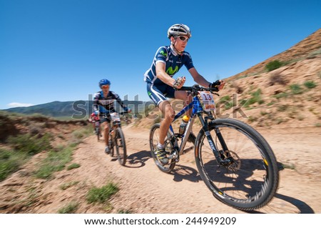 ALMATY, KAZAKHSTAN - MAY 05, 2013: A.Buyanauskas (N13) in action at Adventure mountain bike cross-country competition in mountains \