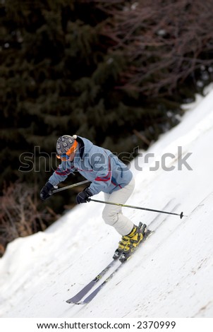 Extreme girl downhill on ski mountain resort