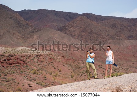 Couple walking in the desert mountains
