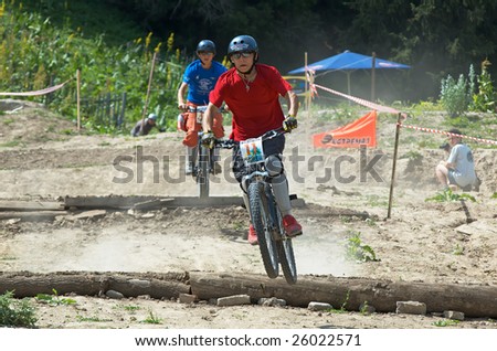 ALMATY, KAZAKHSTAN - JULY 3: Artem Morgunov (number 11) in action at bike cross competition Kumbel Hotel Hasa Cup in Almaty, Kazakhstan July 3, 2005.