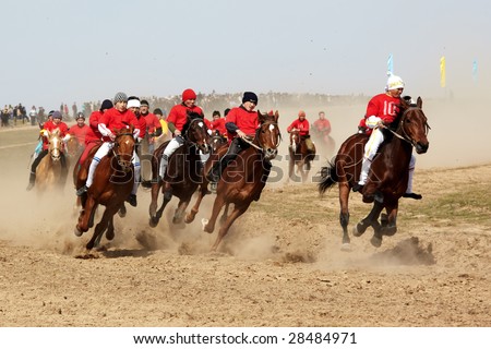 AKCHI, KAZAKHSTAN - MARCH 22 : A traditional national nomad long-distance horse riding competition Bayga  in action on MARCH 22, 2009 in Akchi, Kazakhstan.