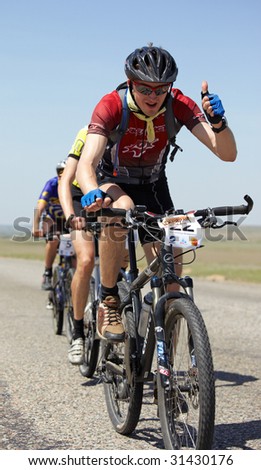 ALMATY, KAZAKHSTAN - MAY 1: Vladimir Filipchuk (N22) in action at Adventure mountain bike cross-country marathon in desert \