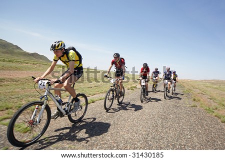 ALMATY, KAZAKHSTAN - MAY 1: Dmitry Rakhimkulov (N21) in action at Adventure mountain bike cross-country marathon in desert 