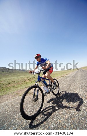 ALMATY, KAZAKHSTAN - MAY 1: Janibek Satkynaliev in action at Adventure mountain bike cross-country marathon in desert 
