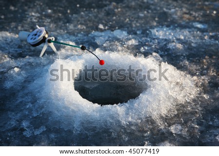 Little winter fishing rod in the hole