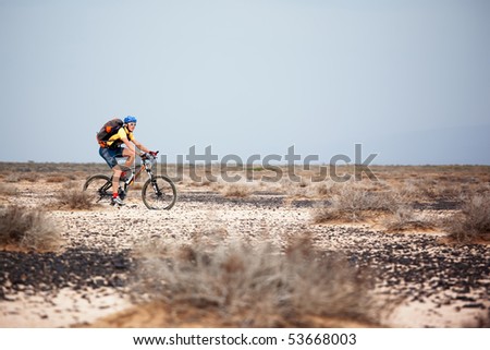 ALMATY, KAZAKHSTAN - MAY 1: V.Kochetov (N26) in action at Adventure mountain bike marathon in desert \