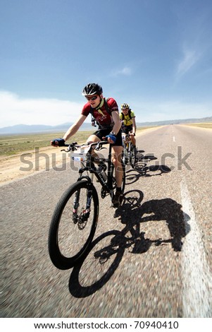 ALMATY, KAZAKHSTAN - May 1: V.Philipchuk (N22) in action at Adventure mountain bike cross-country marathon in desert 