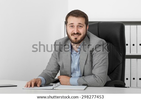 happy man businessman at his desk