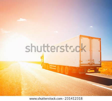 truck driving to sunset