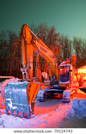excavator in the snow