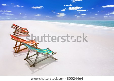 lounge chairs at a coastline