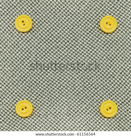 Yellow buttons on the gray fabric