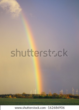 rainbow after rain at a wind farm in Sachsen-Anhalt, Germany