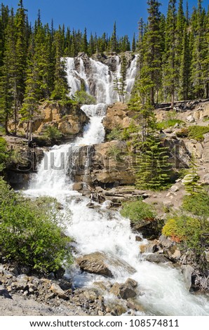 waterfall in deep forest of Rocky Mountains, Alberta, Canada.