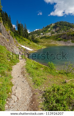 Fragment of a trail with beautiful mountain lake in Mount Baker Visitor Center, WA, USA.