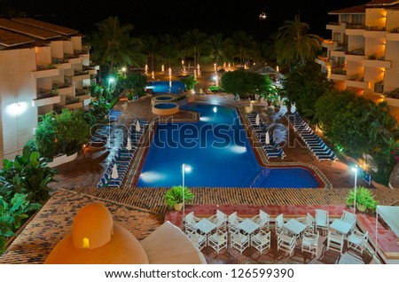 luxury resort with pool at night view