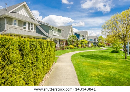 A perfect neighborhood. Houses in suburb at Spring in the north America