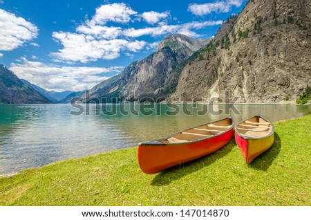Mountain lake and boats. Seton Lake in Lillooet, Vancouver, Canada. Beauty world.