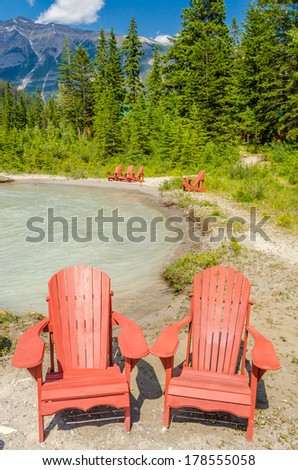 colorful chairs over fantastic mountain river view