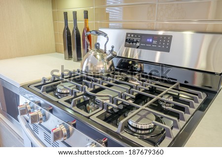 Stove closeup in modern kitchen interior with stainless steel gas cook-top