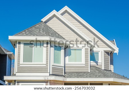 The roof of the house with nice window.