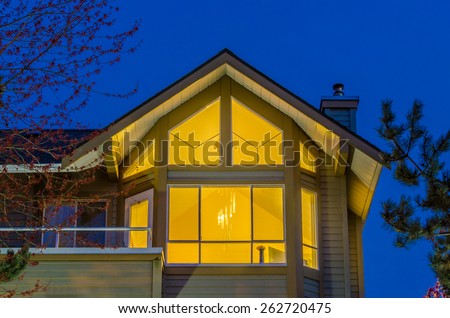 The roof of the house with nice window at night in Vancouver, Canada.