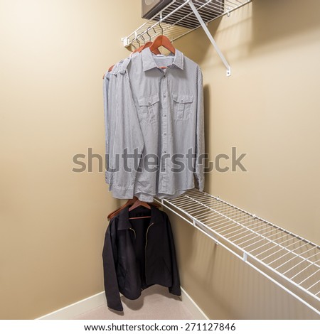 A clothing closet, working closet, cupboard in bedroom.