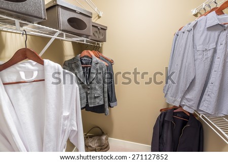 A clothing closet, working closet, cupboard in bedroom.