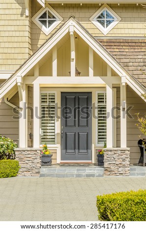 A nice entrance of a luxury house over outdoor landscape
