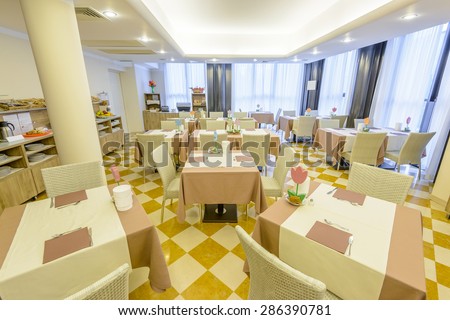 Interior of a hotel restaurant, breakfast room.