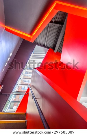 Painted in Red. Abstract fragment of the architecture of modern lobby, hallway of the luxury hotel, shopping mall, business center in Vancouver, Canada. Interior design.