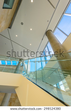 Window and blue sky. Abstract fragment of the architecture of modern lobby, hallway of the luxury hotel, shopping mall, business center in Vancouver, Canada. Interior design.