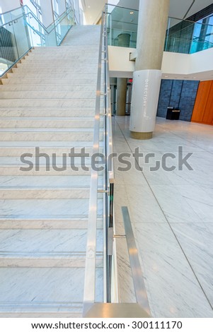 White staircase. Abstract fragment of the architecture of modern lobby, hallway of the luxury hotel, shopping mall, business center in Vancouver, Canada. Interior design.