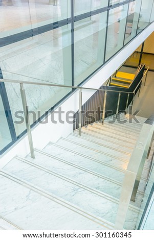 White staircase. Abstract fragment of the architecture of modern lobby, hallway of the luxury hotel, shopping mall, business center in Vancouver, Canada. Interior design.