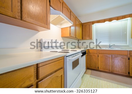 An empty kitchen in a house.