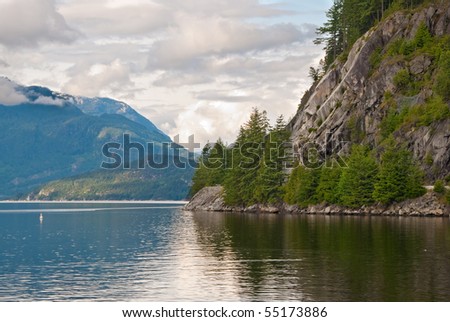 Mountains and ocean landscape, good cloudy evening in British Columbia, Canada.