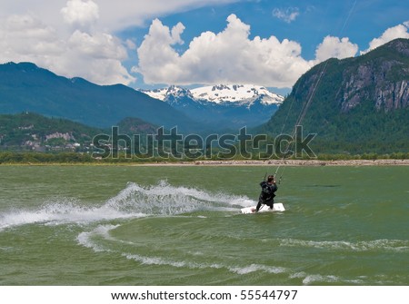 kite boarding on a beach of sea, sportsmen in action