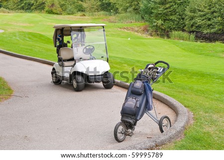 Golf cart and two wheel pull cart.