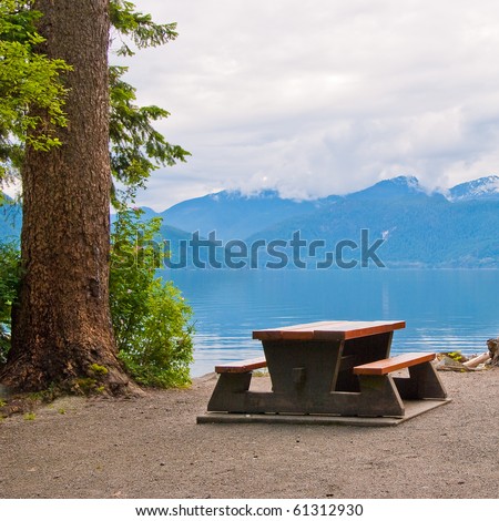 A picnic table with gorgeous view at the ocean.