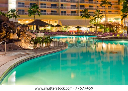resort with pool at night view